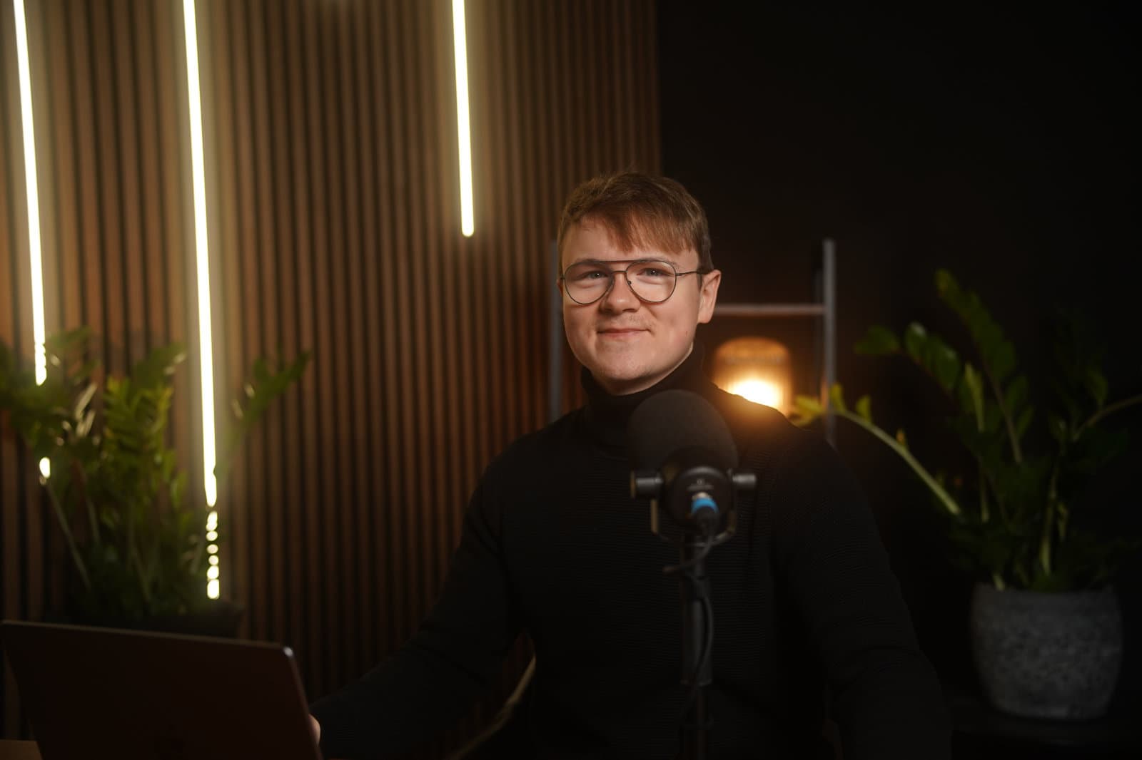 Pascal Poredda sitting in a podcast studio